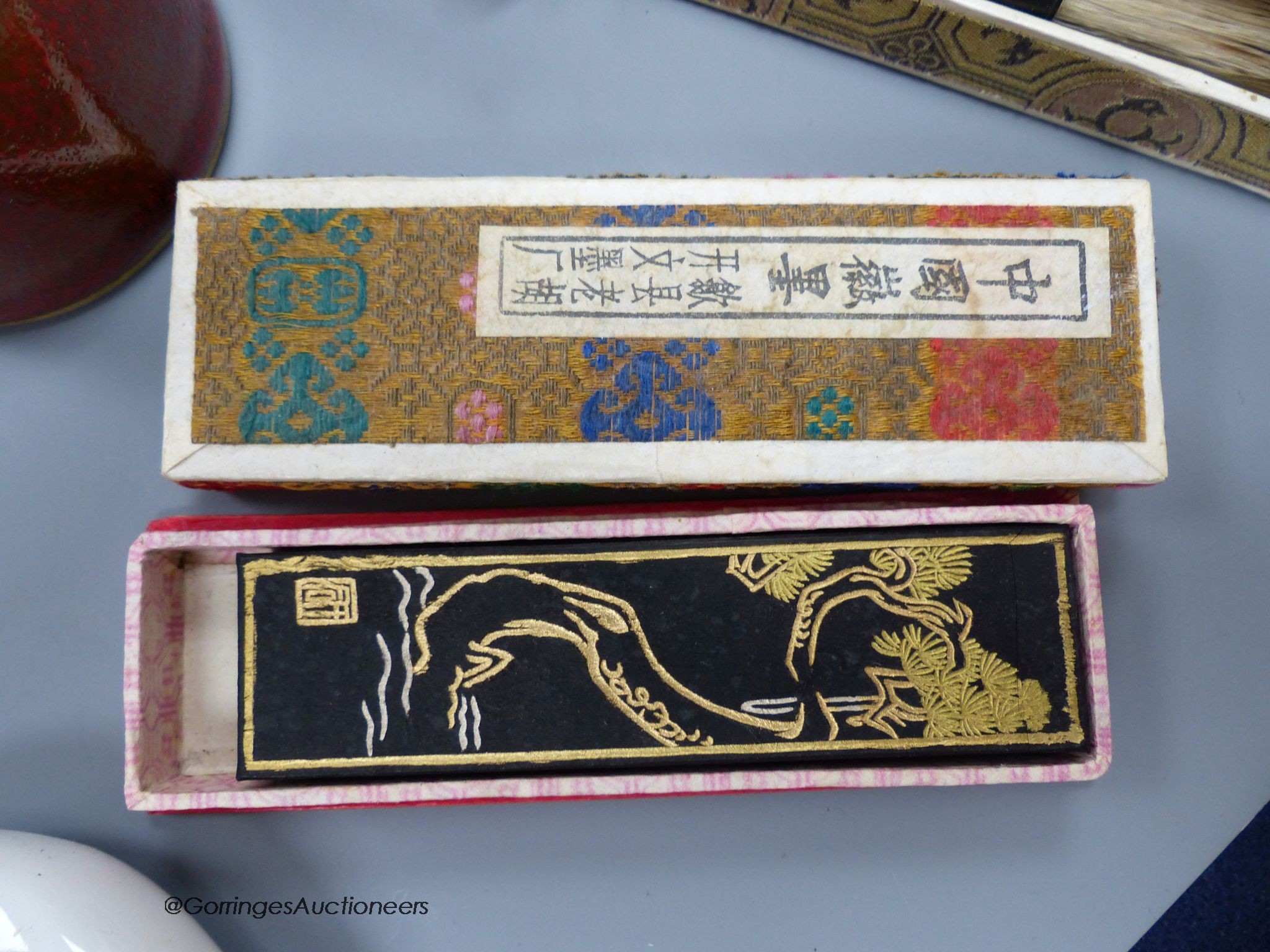 A Chinese inkstone and other calligraphy related items